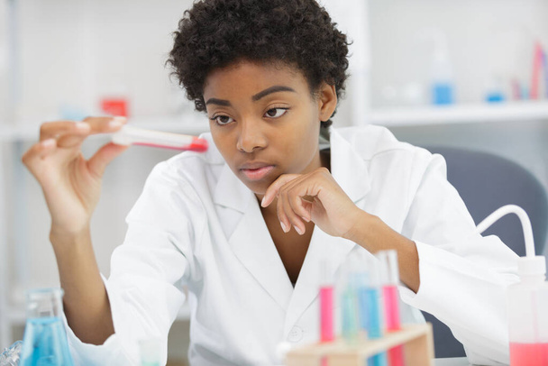 female laboratory assistant with blood test for aids - Zdjęcie, obraz