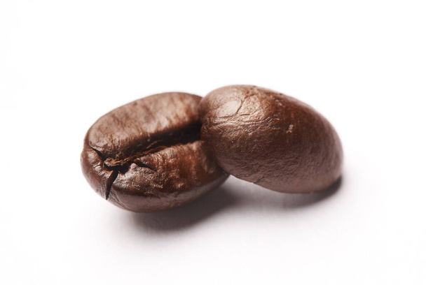 Keep calm and drink coffee. Studio shot of coffee beans against a white background. - 写真・画像