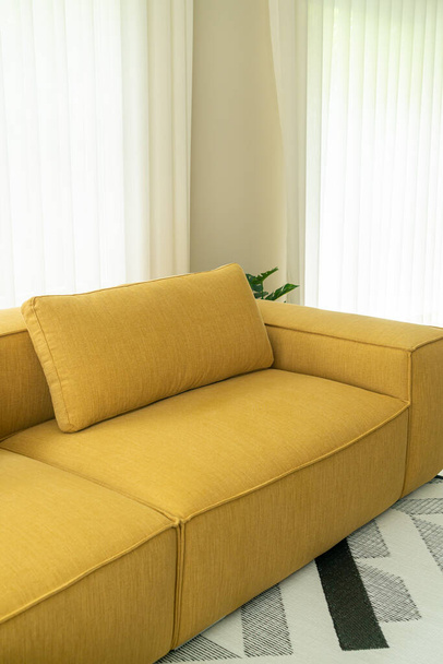 empty yellow fabric sofa decoration interior in living room at home - Zdjęcie, obraz