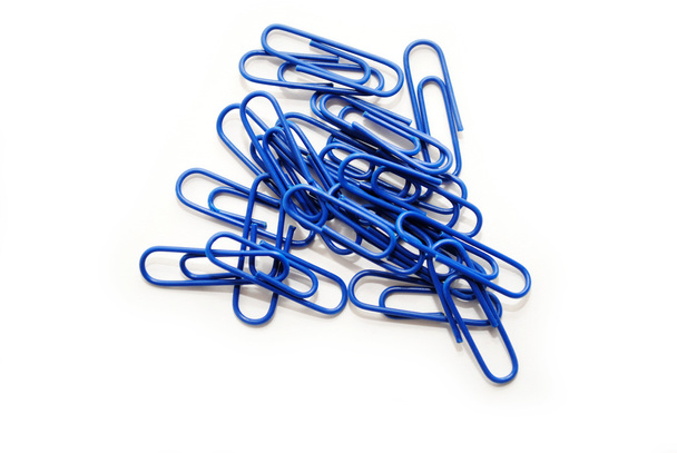 Dark Blue Paperclips Over a White Background - Photo, Image