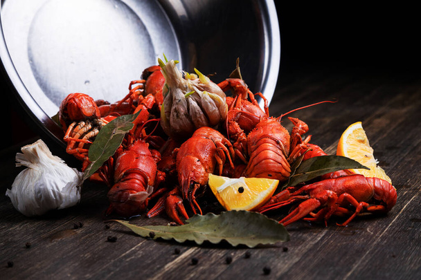delicacy for beer, boiled red crayfish with lemon and bay leaves - 写真・画像