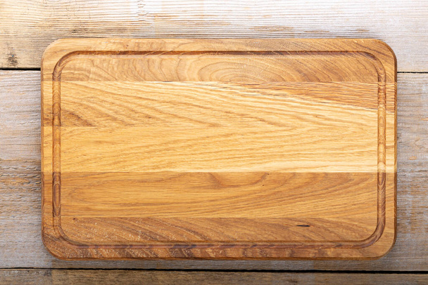 Chopping kitchen boards on a wooden background.  - Φωτογραφία, εικόνα