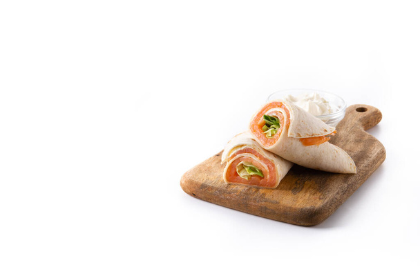 Salmon wrap sandwich roll with cheese and vegetables isolated on white background. Copy space - Фото, зображення
