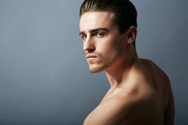 Seriously handsome. Cropped shot of a handsome young man posing in the studio. - 写真・画像