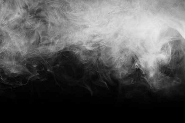 Abstract smoke texture over black. Fog in the darkness. - Photo, image