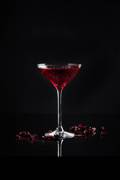 Cocktail in a glass on a black background - Photo, image