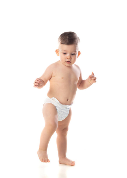 Funny child baby boy toddler naked in diaper isolated on a white background  - Zdjęcie, obraz