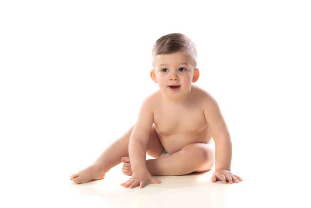 Funny child baby boy toddler naked in diaper isolated on a white background  - Фото, изображение