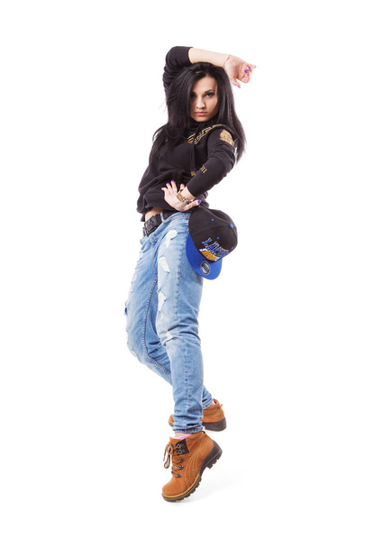 Modern hip-hop dance girl pose on isolated background - Фото, зображення