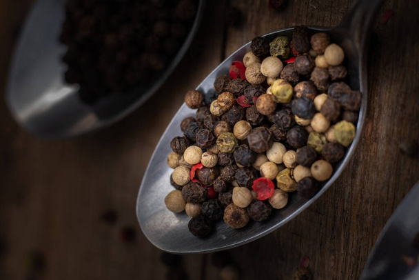 black pepper in a wooden bowl - Photo, Image