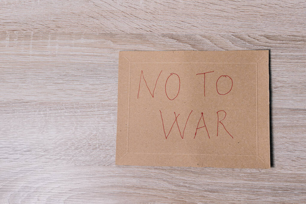 no to war sign  on wood background - Foto, Imagen