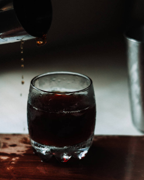 glass of whiskey with ice and red wine - Fotoğraf, Görsel