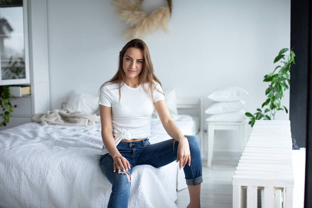 Female portrait. Attractive young woman at home. - Foto, afbeelding