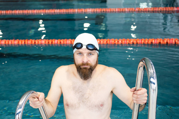 casual man in a swimming pool active lifestyle - Foto, afbeelding