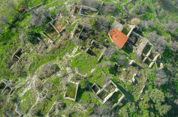 Rural depopulation in Cyprus. Ruins of traditional village houses, view directly above - Photo, Image