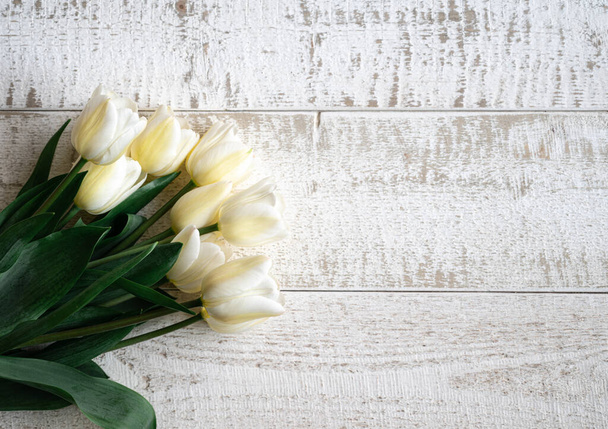 Copy space of tulips on the wooden background - Photo, Image