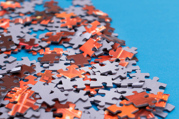Colorful Jigsaw Puzzle on Blue Background - Foto, Bild