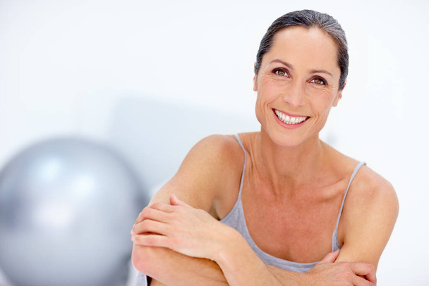 Staying healthy and fit. Portrait of a beautiful mature woman posing in studio. - Photo, Image