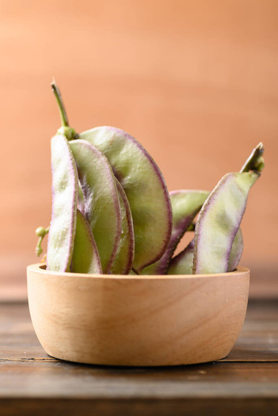 Asian Hyacinth bean in bowl on wooden background - Photo, Image