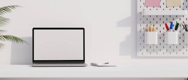 Cómodo escritorio de oficina del espacio de trabajo con portátil portátil mockup pantalla blanca y espacio de copia en la mesa blanca. representación 3d, ilustración 3d - Foto, imagen