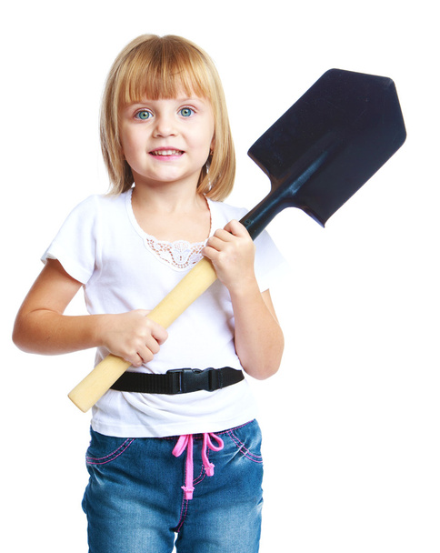 Little girl with a construction shovel. - Fotoğraf, Görsel