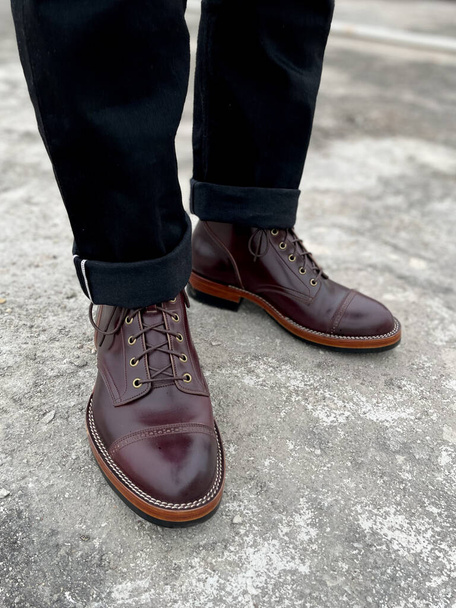 man's shoes on a background of a brown leather boots - Foto, Imagem