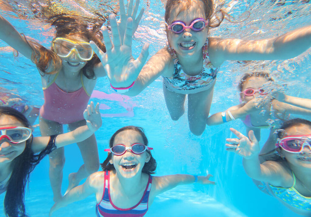 little happy  kids swimming  in pool  underwater. - Foto, Imagem