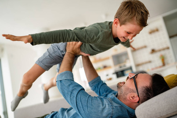 Parent and child being friends. Joyful father and son having fun, spending tim at home together. Single dad concept - Fotoğraf, Görsel