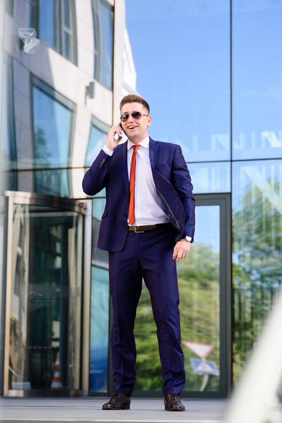A man business man talking on the phone on the street - Photo, image