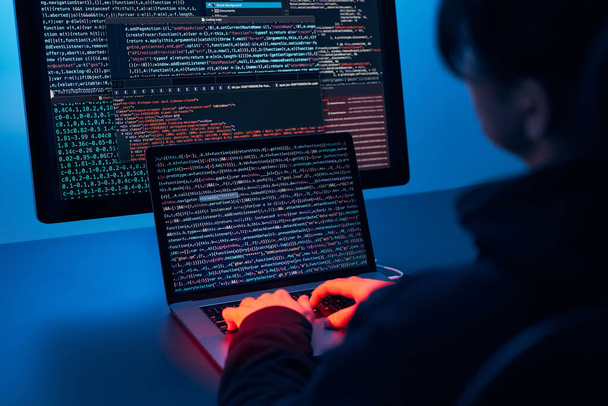 Man using computer and programming  to break code. Cyber security threat. Internet and network security. Stealing private information. Person using technology to steal password and private data. Cyber attack crime - Foto, Imagen