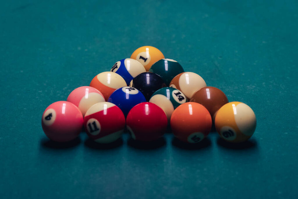 Close up on a billiard balls on a green cloth in a pub - Фото, зображення