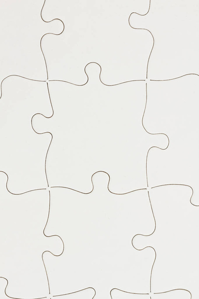 Weißer Puzzle-Hintergrund mit Kopierplatz für Ihre Geschäfts- oder Verbindungsnachricht - Foto, Bild