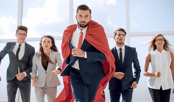 businessman superhero and his business team are stepping togethe - Photo, image