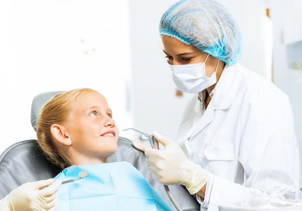 Dentist inspecting patient - Фото, зображення
