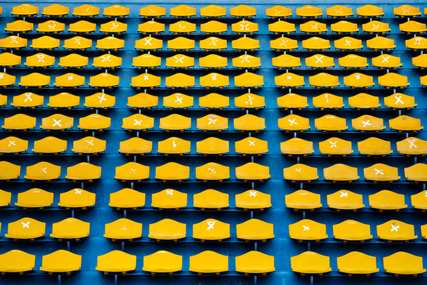 Yellow grandstand are sticked cross signs for social distancing standard. - Valokuva, kuva