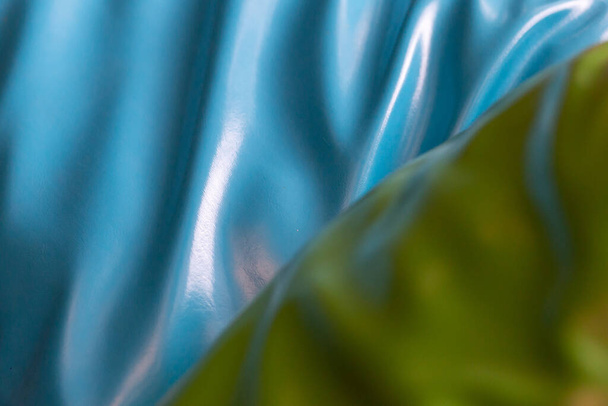 blauwe en groene textuur Lederen bekleding in een café. Afbeelding voor achtergrond. en vul tekst in - Foto, afbeelding