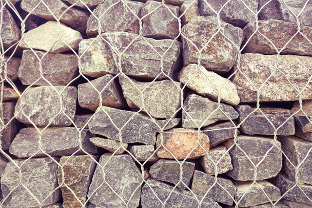 Háttérfal nagy sziklák védelme összeomlás ellen - Fotó, kép
