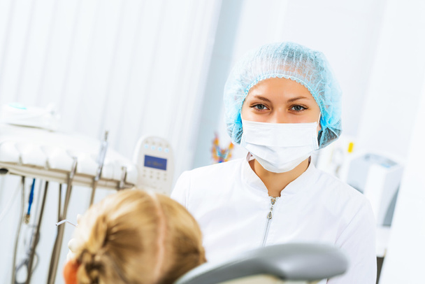 Dentist inspecting patient - Фото, изображение