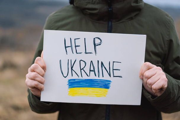 Πόλεμος της Ρωσίας εναντίον της Ουκρανίας. Ουκρανός ζητά να σταματήσει τον πόλεμο στην Ουκρανία. - Φωτογραφία, εικόνα