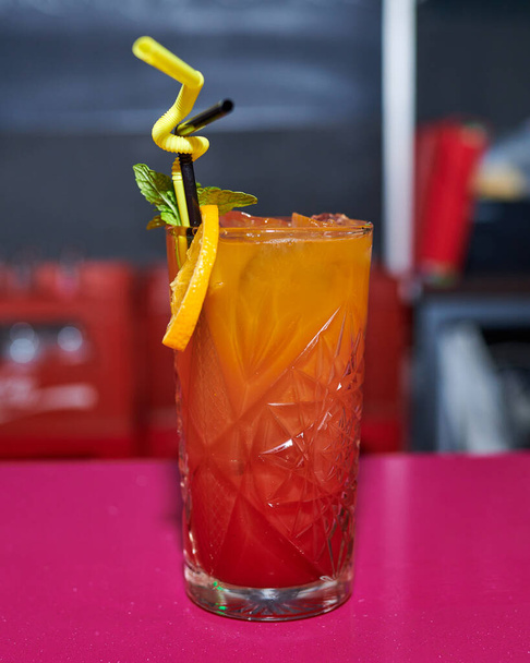 cocktail with lemon and mint on a bar counter - Fotó, kép