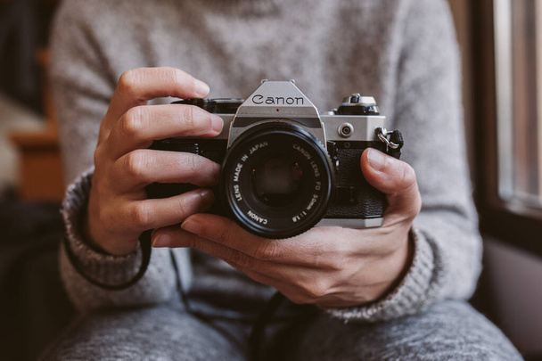 close-up of a woman's hands holding a camera - Photo, image