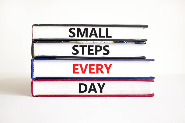 Small steps every day symbol. Concept words Small steps every day on books. Beautiful white table white background. Small steps every day business concept. Copy space. - Foto, imagen