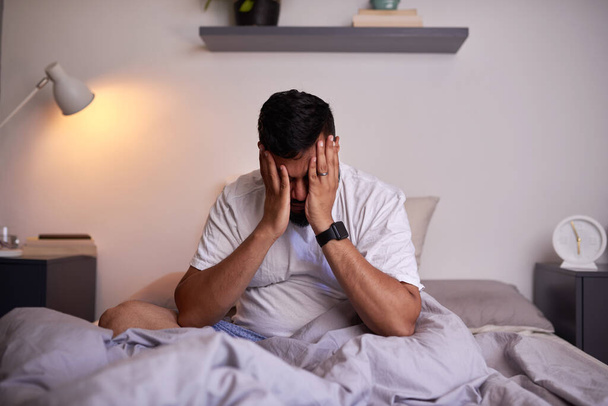 A wide shot of an adult man struggling to wake up in the early morning - Photo, Image
