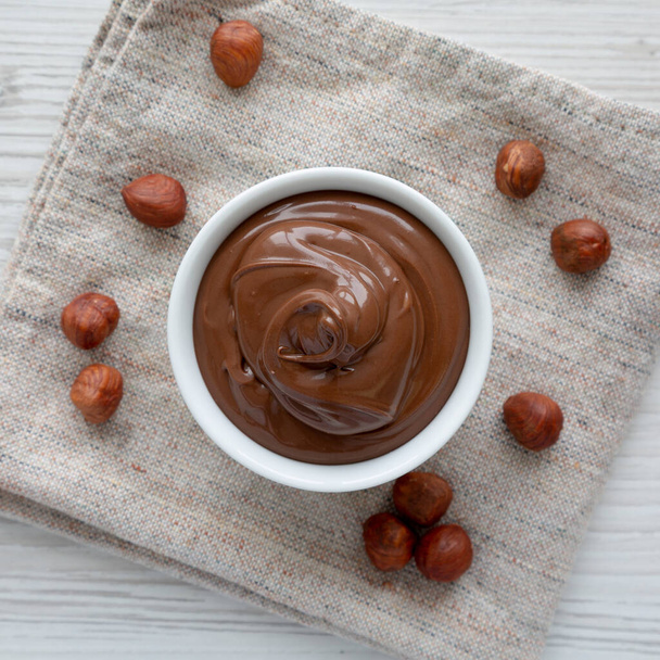 Homemade Chocolate Hazelnut Spread in a Bowl, top view. From above, overhead, flat lay. - Photo, Image