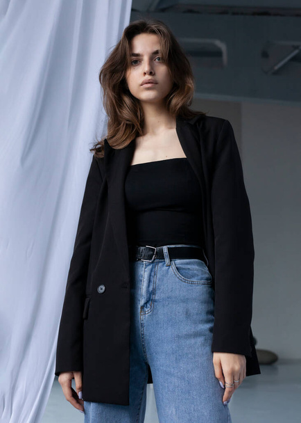 beautiful girl posing in a black spring jacket - Photo, Image