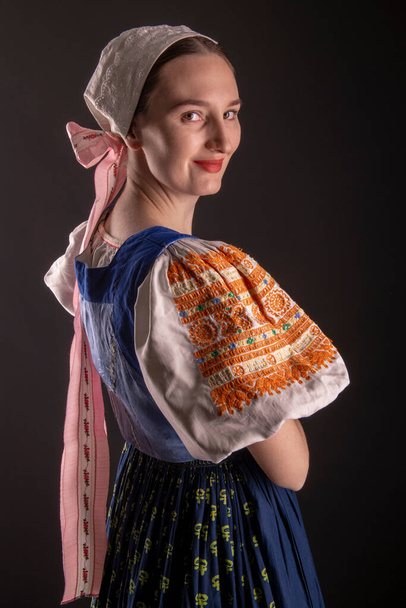 Beautiful girl. Traditional Slovak folk dress. - Foto, imagen