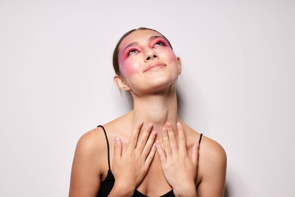 fashionable woman pink face makeup posing attractive look light background unaltered - 写真・画像