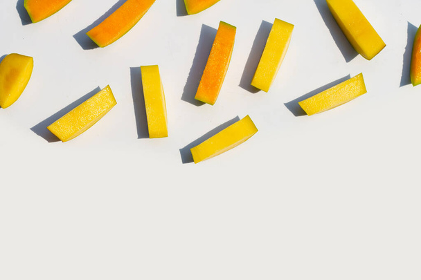 Mango cut pieces on white background. - Foto, afbeelding