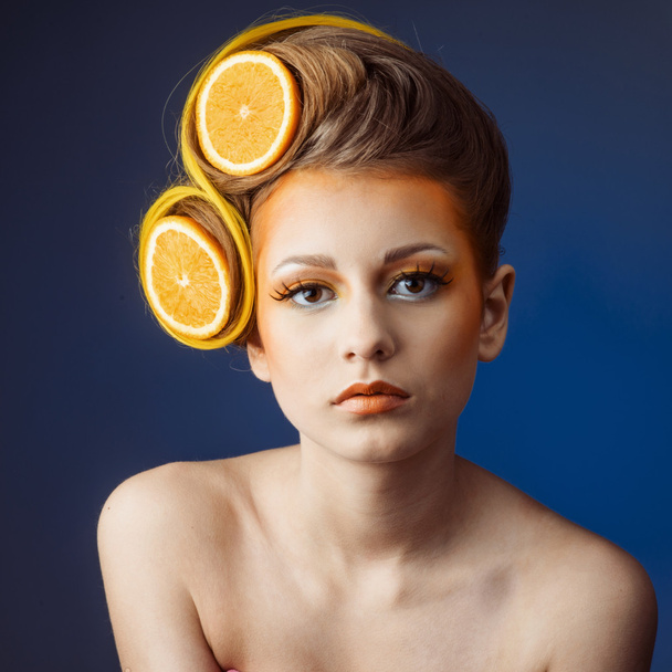 woman with fruit in hair - Фото, изображение