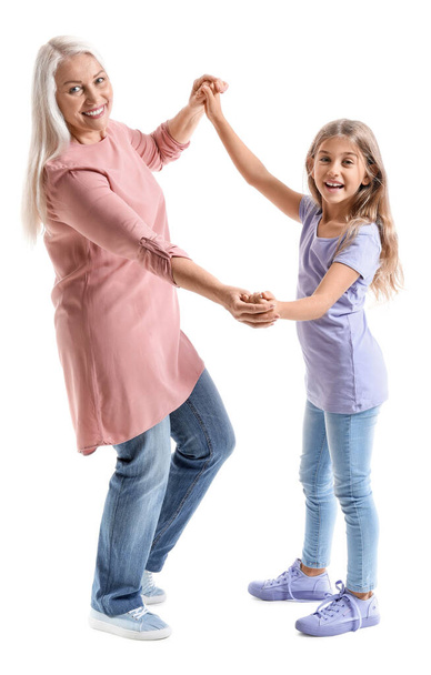 Happy little girl with her grandma on white background - Фото, зображення
